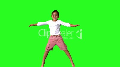 Little girl jumping on green screen