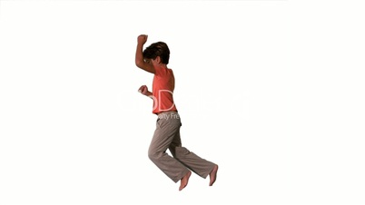 Side view of boy jumping on white background