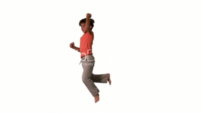 Side view of boy jumping up and down on white background
