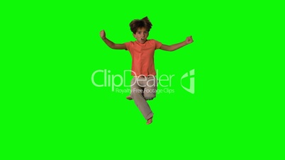 Boy jumping and cheering on green screen