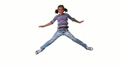 Happy girl jumping up and down on a white background