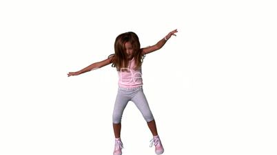 Cute little girl jumping with limbs outstretched on white background