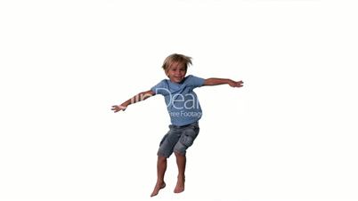 Boy in denim shorts jumping on white background