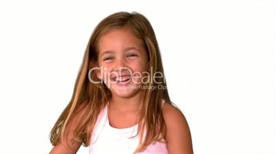 Close up of little girl laughing and turning on white background