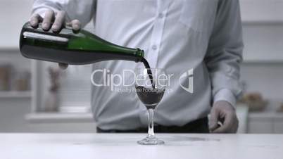 Man pouring wine into a glass