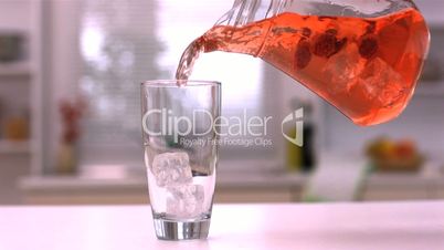 Pouring juice into a glass