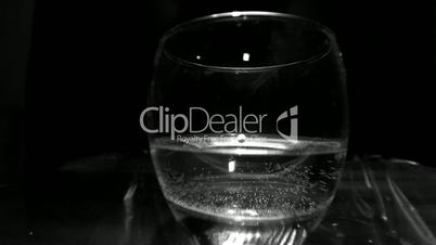 Drop falling into a glass