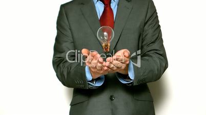 Man tossing light bulb