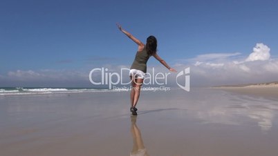 back woman flying on beach