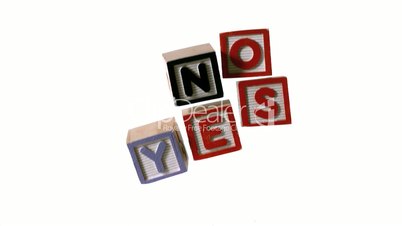 Blocks spelling yes and no falling over on white background