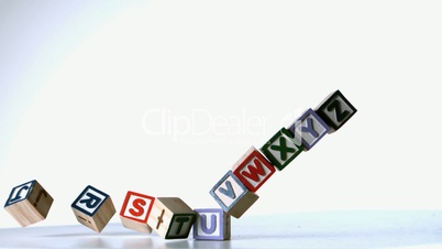 Some alphabet blocks dropping down