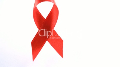 Red Aids awareness ribbon dropping down