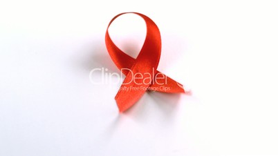 Aids red ribbon symbol dropping down