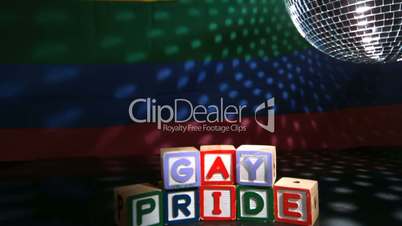 Disco ball spinning above gay pride blocks