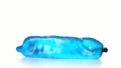 Blue condom filled with water falling and bouncing