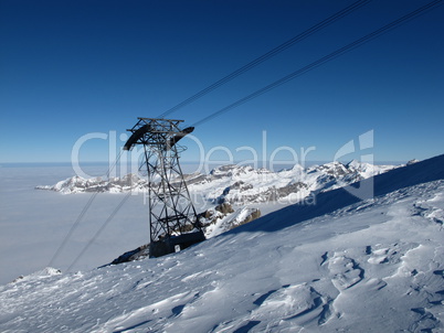 Pylon of a cable car, sea of fog and mountains, Titlis