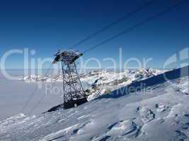 Pylon of a cable car, sea of fog and mountains, Titlis