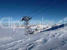 Cable car pylon on the Titlis, sea of fog and mountains