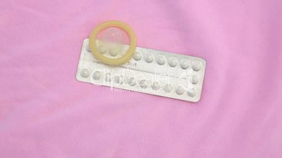 Contraceptive pill packet with condom