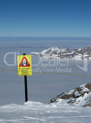 Crevasses, danger sign on the Titlis, sea of fog