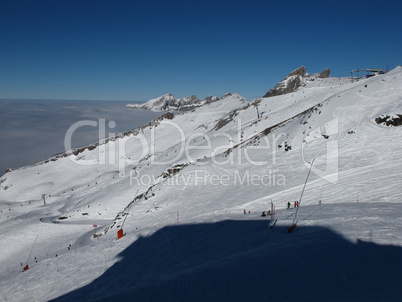 Chair lift in the Titlis ski area, sea of fog