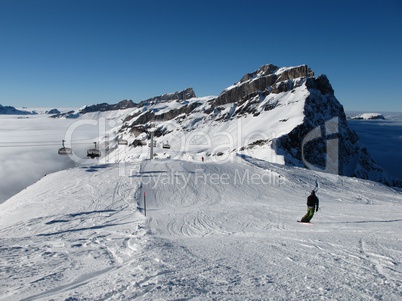 Snowboarder in the Titlis ski region, mountain