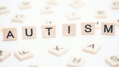 Autism spelled out in letter pieces standing up