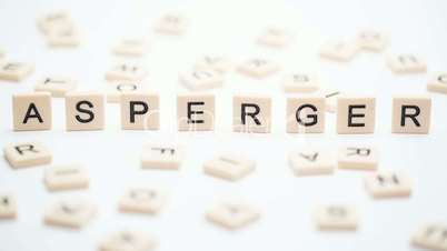 Asperger spelled out in plastic letter pieces standing up