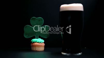 Pint of stout and st patricks day cupcake