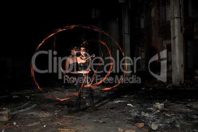 Woman holds in his hand the fire