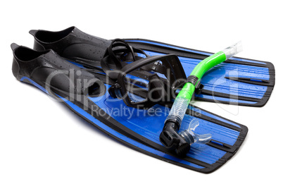 Mask, snorkel and flippers with water drops. Diving gear on whit