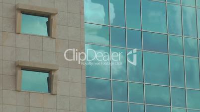 Office building with clouds time lapse