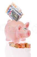 Rosa Sparschwein mit Münzen und Geldscheinen- Pink piggy bank w