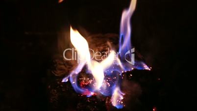 burning fire in  fireplace in the night