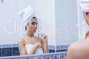 Young woman brushing her teeth