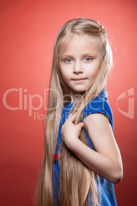 Beautiful blonde little girl with long hairs