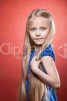 Beautiful blonde little girl with long hairs