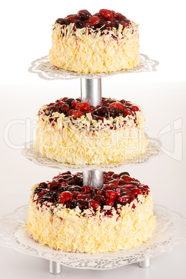 Three-story cake almond with red berries