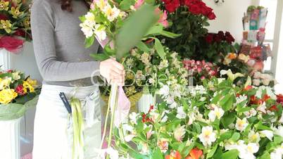 Florist Arranging Bunch Of Flowers In Floristry Shop