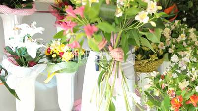 Florist Making Alstroemeria Bouquet In Flower Shop