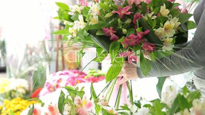 Florist Arranging Bouquet Of Alstroemeria