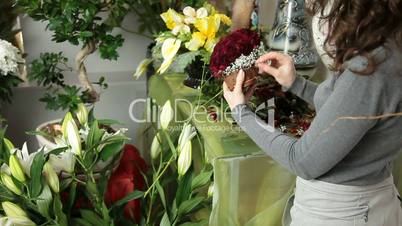 Florist Arranging Valentines Day Rose Heart Bouquet In Flower Shop