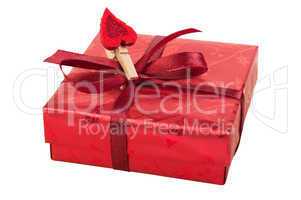 Red gift box with a heart