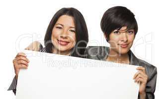 Attractive Mixed Race Mother and Daughter Holding Blank White Si