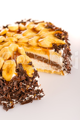 Banana dessert cake with dark chocolate topping