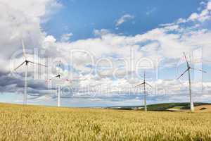 Wheatfield with windmills