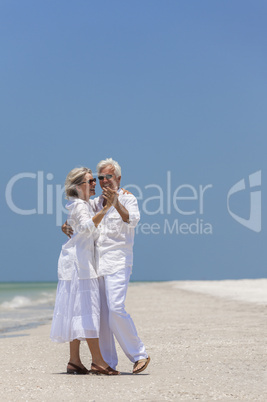 Happy Senior Couple Dancing on Tropical Beach