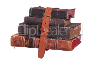 stack of old book with belt