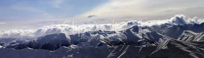 Panorama of winter mountains at sunset