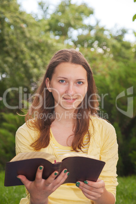 Teen girl reading book